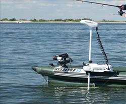 Backcountry Sportsman FSK16 FishSkiff inflatable fishing boat with two-person swivel seat and canopy, shown on water.