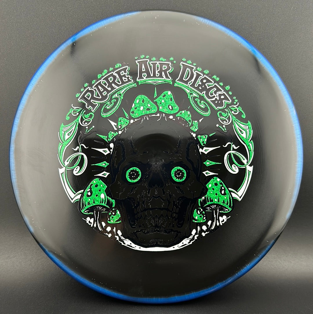 Disc golf disc by Rare Air Discs, Halo S-Blend Tomb Crushin' Amanitas stamp, featuring intricate mushroom artwork on a colorful disc.