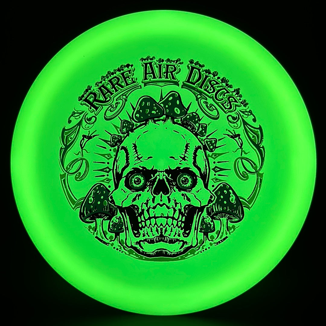 Forged Radiant Era Crushin' Amanitas disc golf stamp by Manny Trujillo on a Rare Air Discs disc, featuring vibrant artwork.