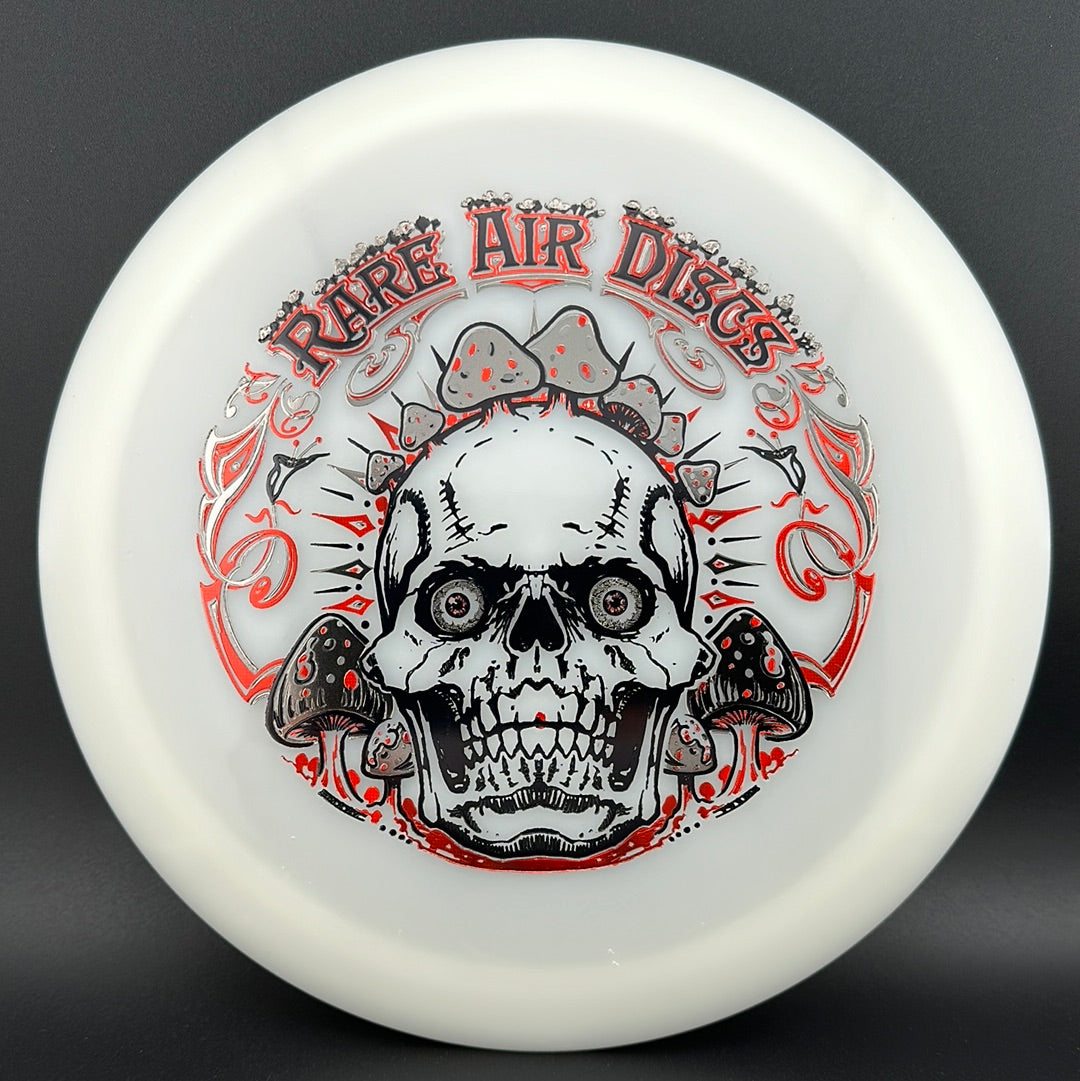 Forged Radiant Era Crushin' Amanitas disc golf stamp by Manny Trujillo on a Rare Air Discs disc, featuring vibrant mushroom artwork.