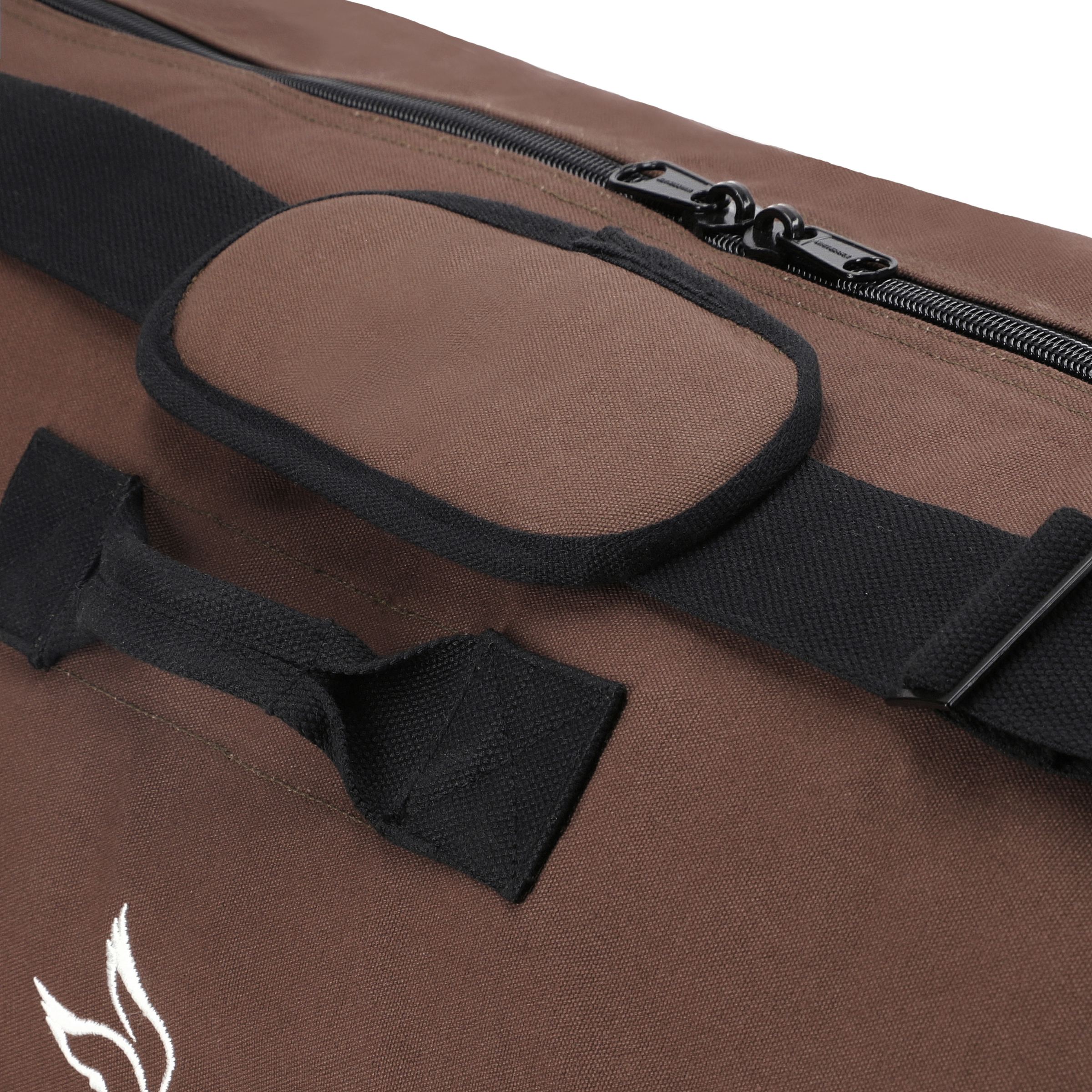 White Duck Outdoors Hoplite Canvas Duffel Bag shown with sturdy leather handles and spacious main compartment.