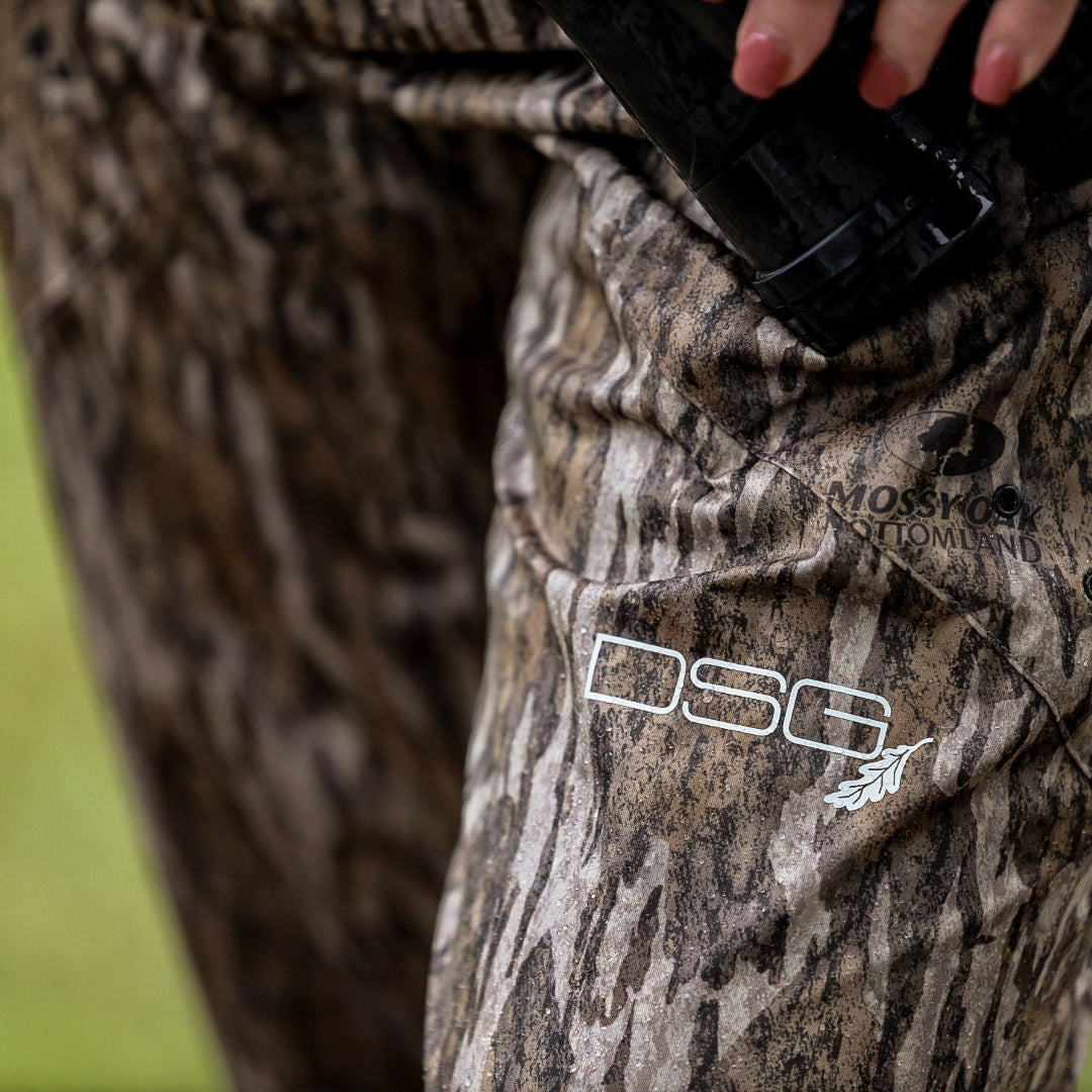 DSG OUTERWEAR Nova Rain Pant in waterproof fabric, lightweight design, with adjustable drawstring waistband and sealed seams.
