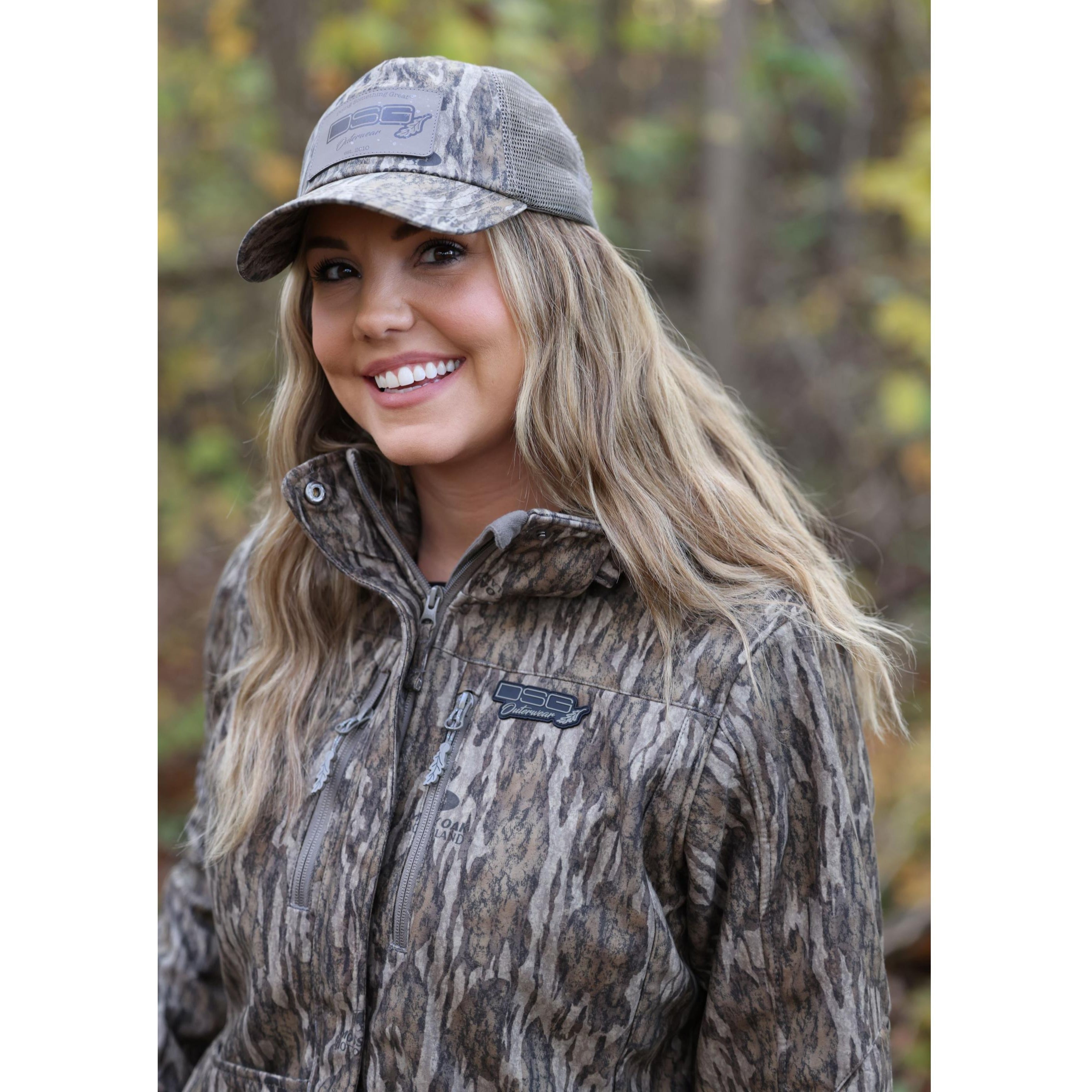 DSG OUTERWEAR Ava 3.0 jacket shown in black with front zipper and hood, featuring a sleek, modern design for outdoor wear.