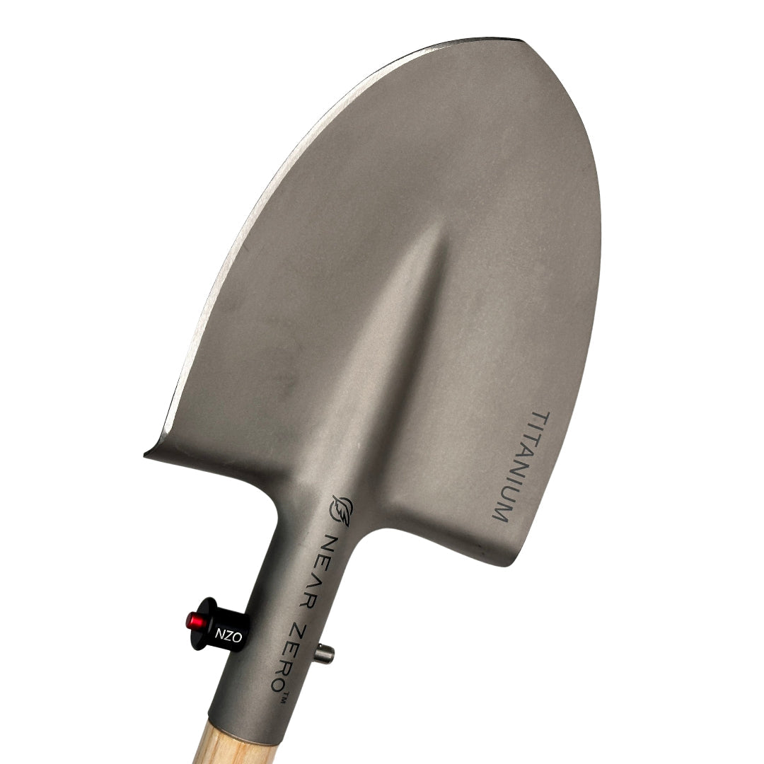 Near Zero Outdoor Gear titanium shovel, a durable camping accessories tool with a lightweight metal blade and ergonomic handle.