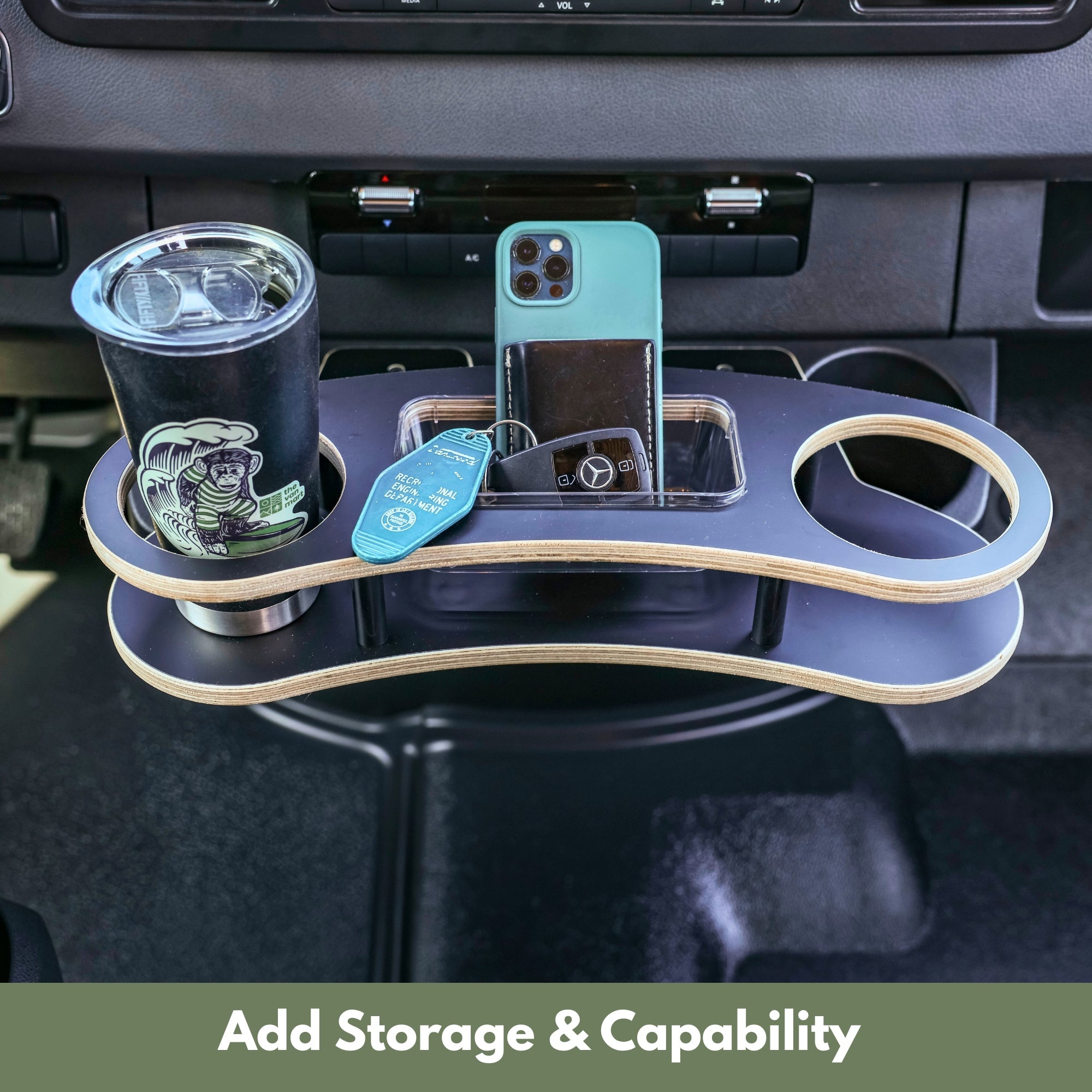 Sprinter Cupholder Tray by The Van Mart in a vehicle cupholder, designed for 2019+ Sprinter vans, holding drinks and small items.