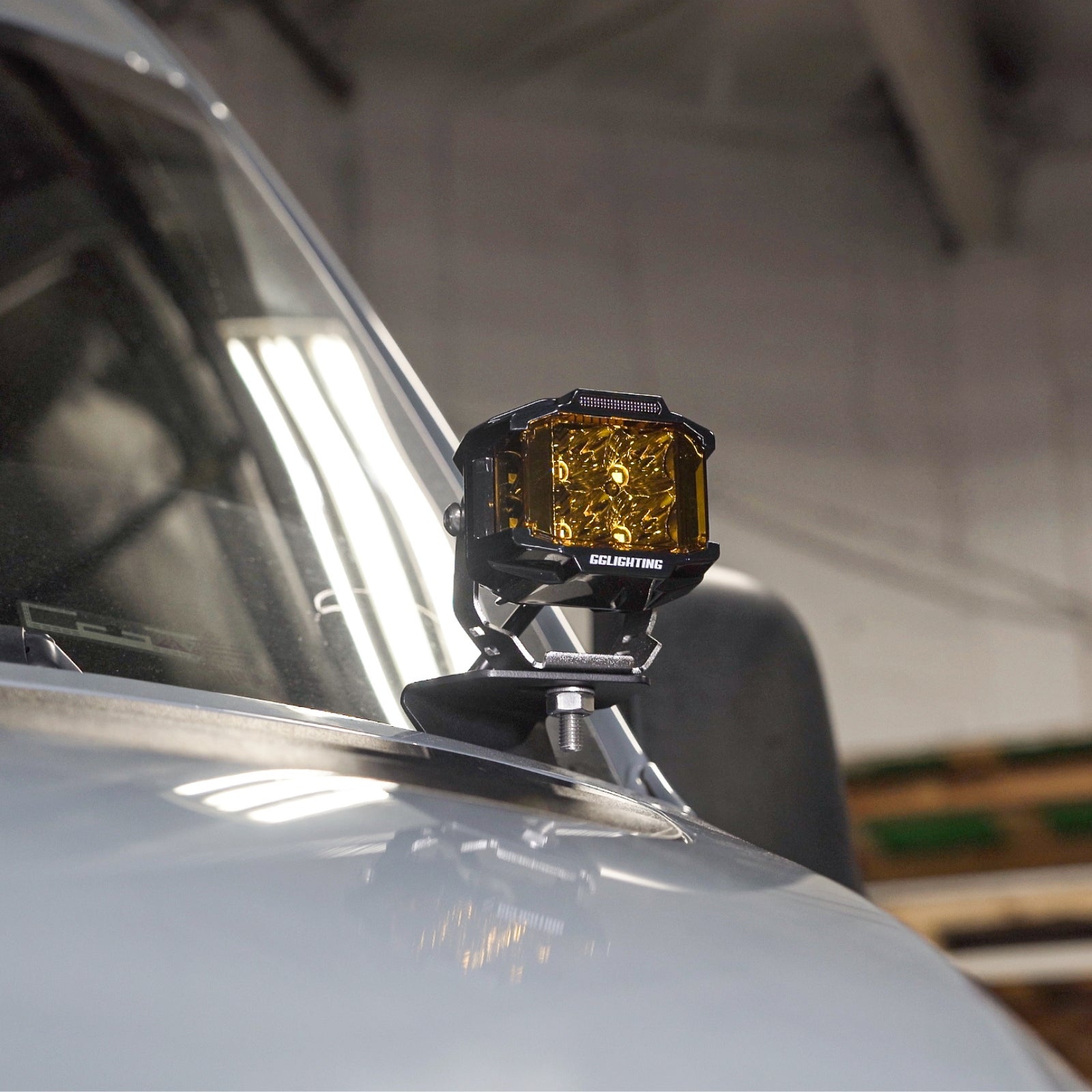 Sprinter Hood Light Mount Kit by The Van Mart, featuring brackets and components for easy installation on a Sprinter van.