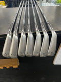 Used Callaway Paradym Ai Smoke Max Fast iron set with graphite shafts, showing the clubheads and grips in a close-up image.