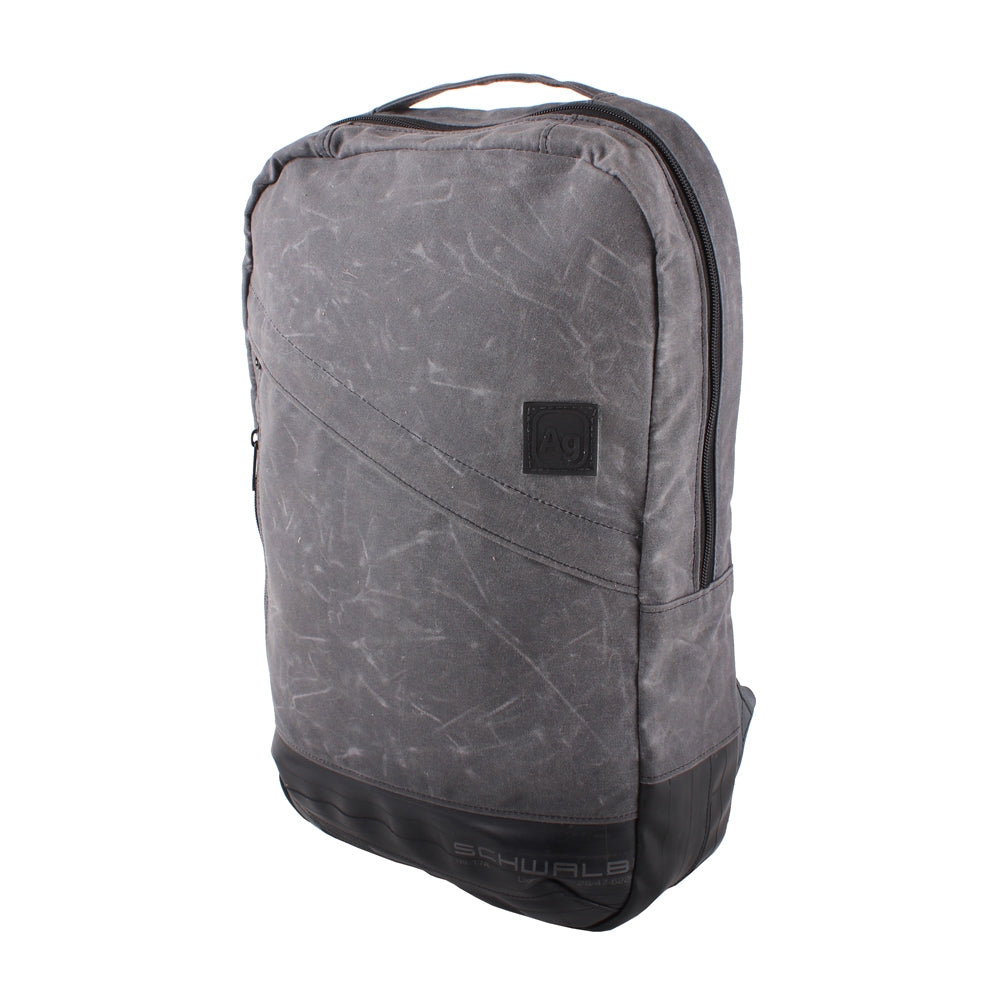 ZeITBIKE Alchemy Goods Brooklyn Waxed Backpack shown from left perspective, durable made-in-USA bag for everyday use.