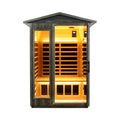 Two-person black carbonized walnut infrared sauna by Thermora Riva with LED lighting and Bluetooth audio, outdoor use, front view.