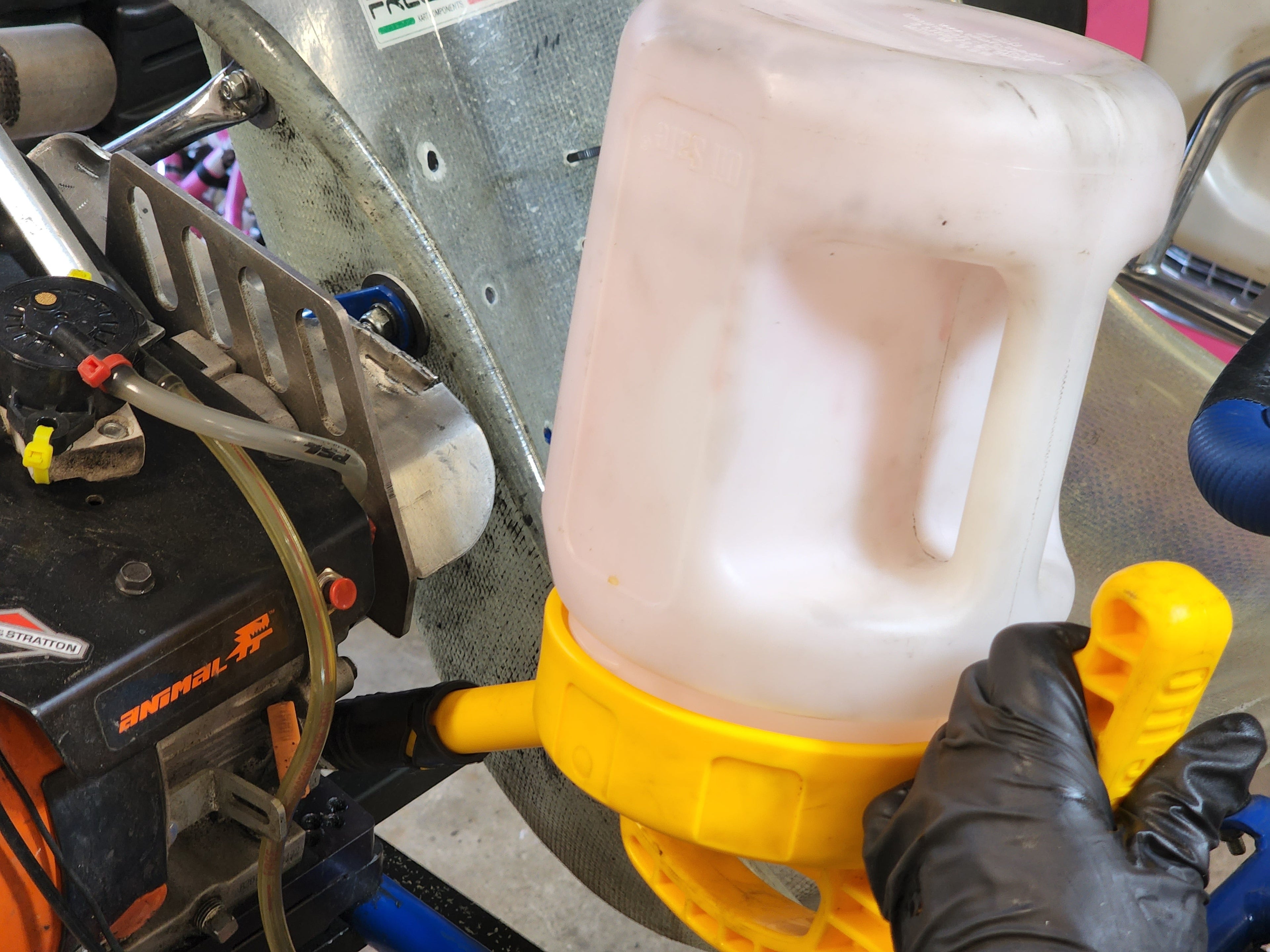 OilSafe Stretch Spout controlled-flow oil transfer lid on DRIVEN Racing Shop transfer container, designed for precise oil pouring.