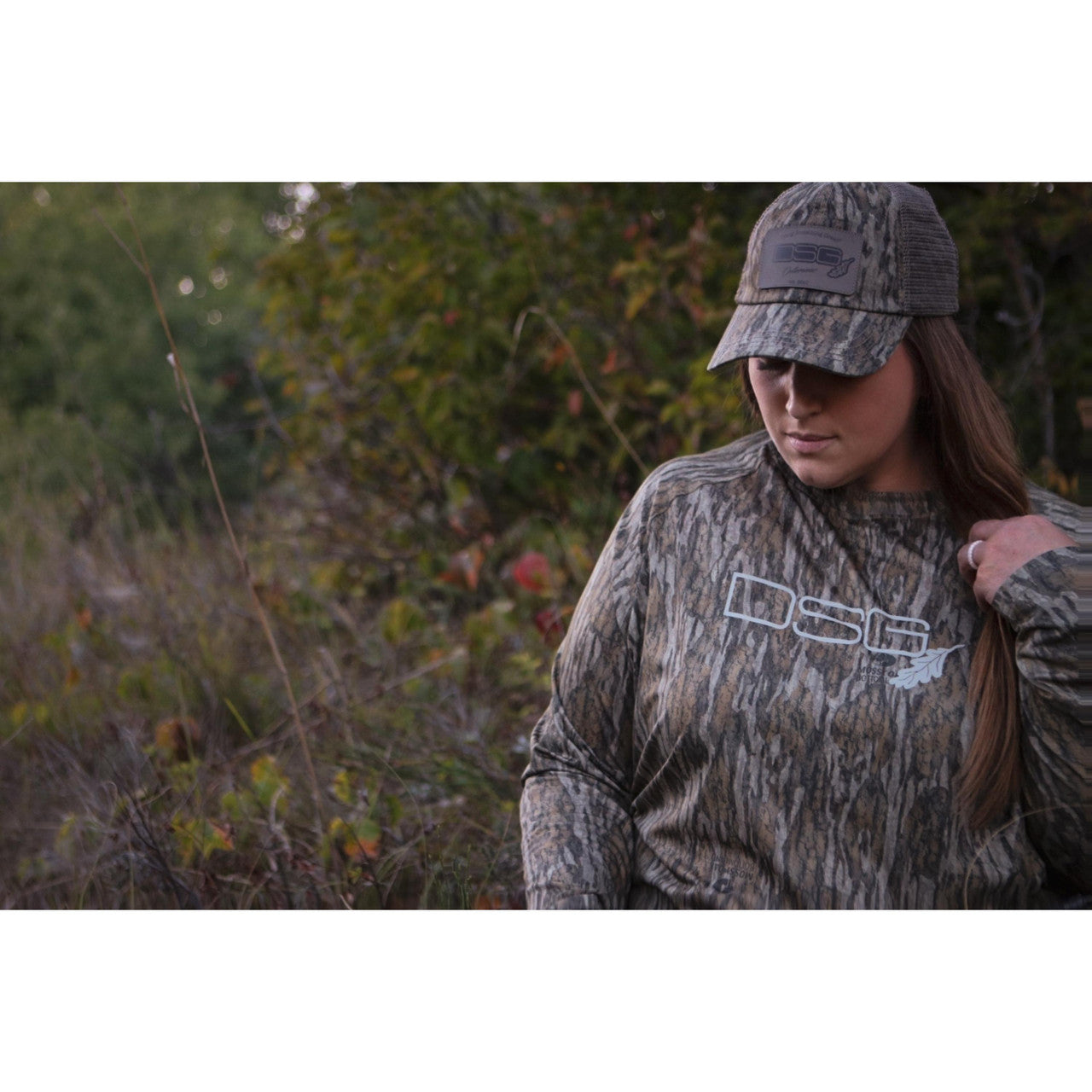 Lightweight long sleeve shirt by DSG OUTERWEAR with UPF 50+ sun protection, shown in a natural pose.