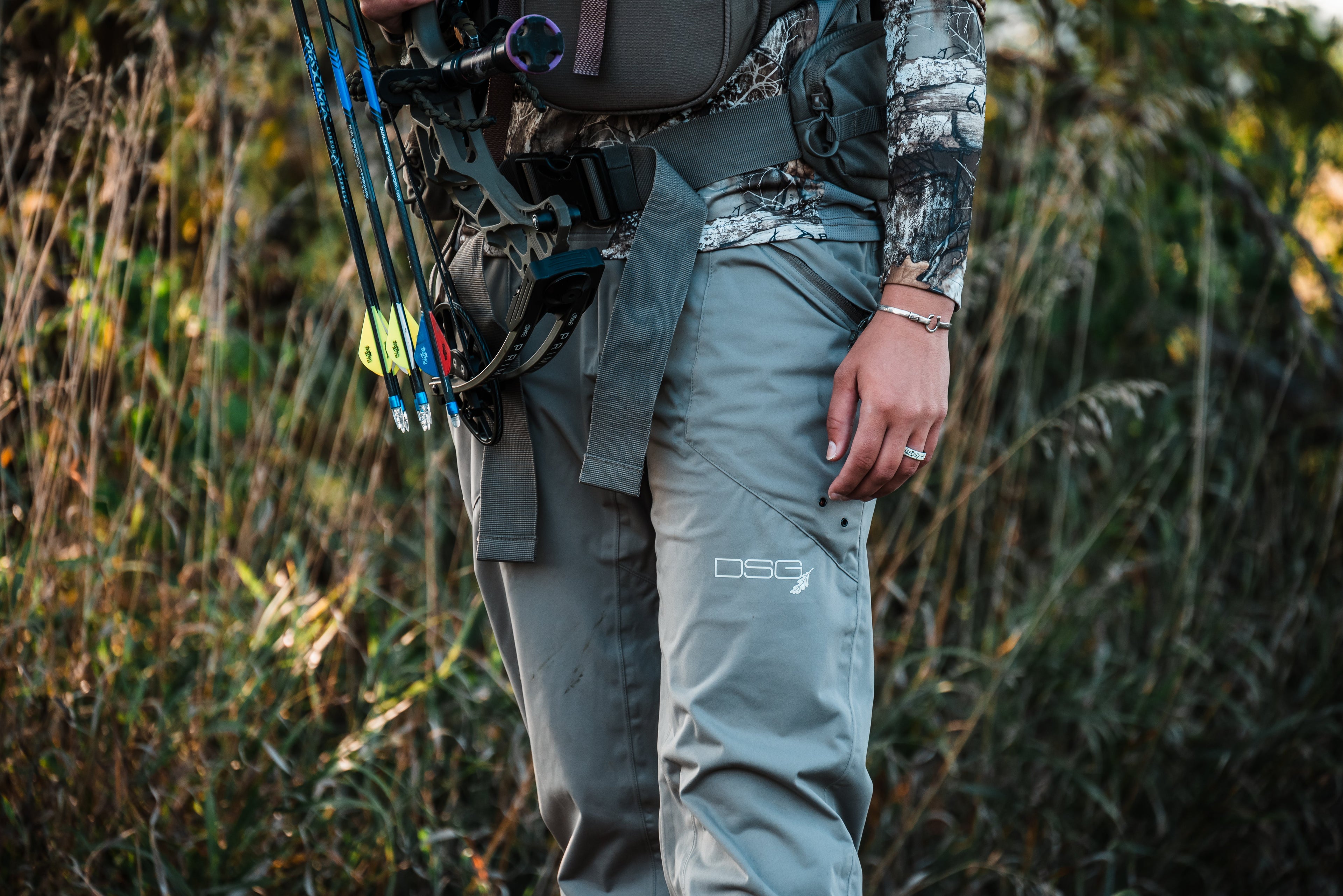Dark gray Nova Rain Pant by DSG OUTERWEAR, featuring waterproof fabric and adjustable waist for outdoor rain protection.