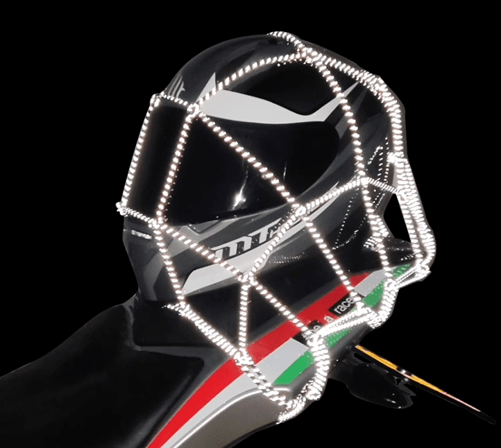 Bean's Moto Booth motorcycle helmet storage net mounted on bike, made of durable mesh for secure helmet organization.