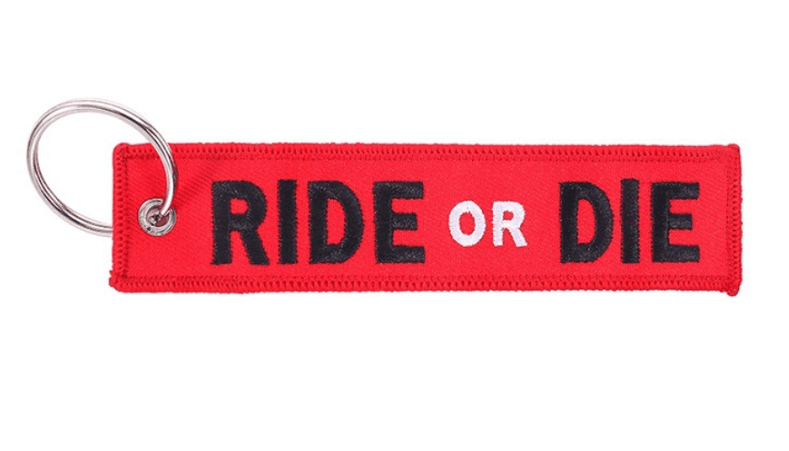 Embroidered motorcycle keychain decor by Bean's Moto Booth with detailed stitching and vibrant colors.