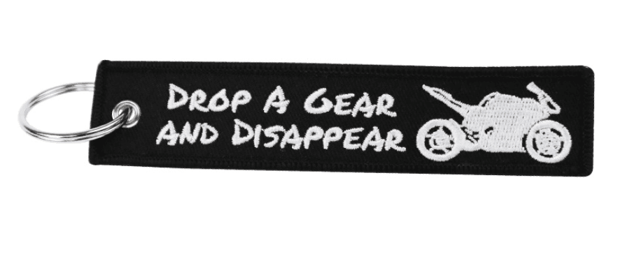 Embroidered motorcycle keychain decor by Bean's Moto Booth featuring detailed stitching and vibrant colors on fabric.