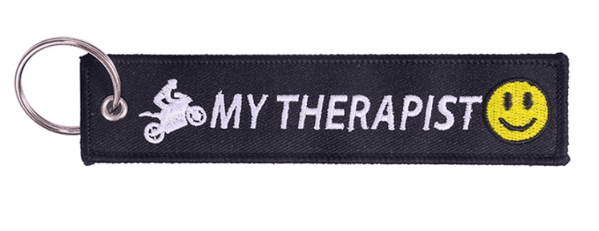 Embroidered motorcycle decor keychain with detailed stitching, featuring a sleek motorcycle design, from Bean's Moto Booth.