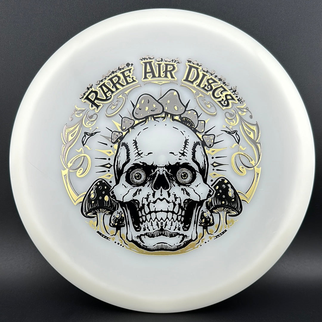 Forged Radiant Supra disc golf stamp by Manny Trujillo on Rare Air Discs' disc, featuring Crushin' Amanitas design with vibrant colors.