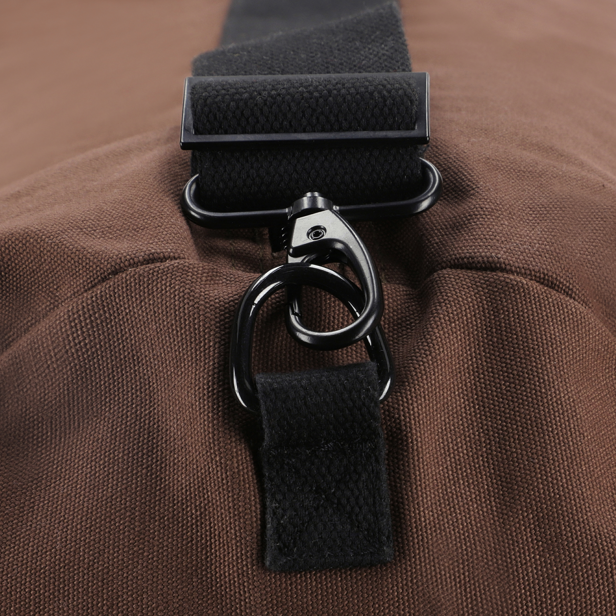 White Duck Outdoors Hoplite Canvas Duffel Bag shown with adjustable shoulder strap and spacious main compartment.