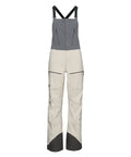 Light khaki Strafe Outerwear Scarlett 3L Shell Bib pants displayed on a flat surface showcasing their waterproof fabric and design.