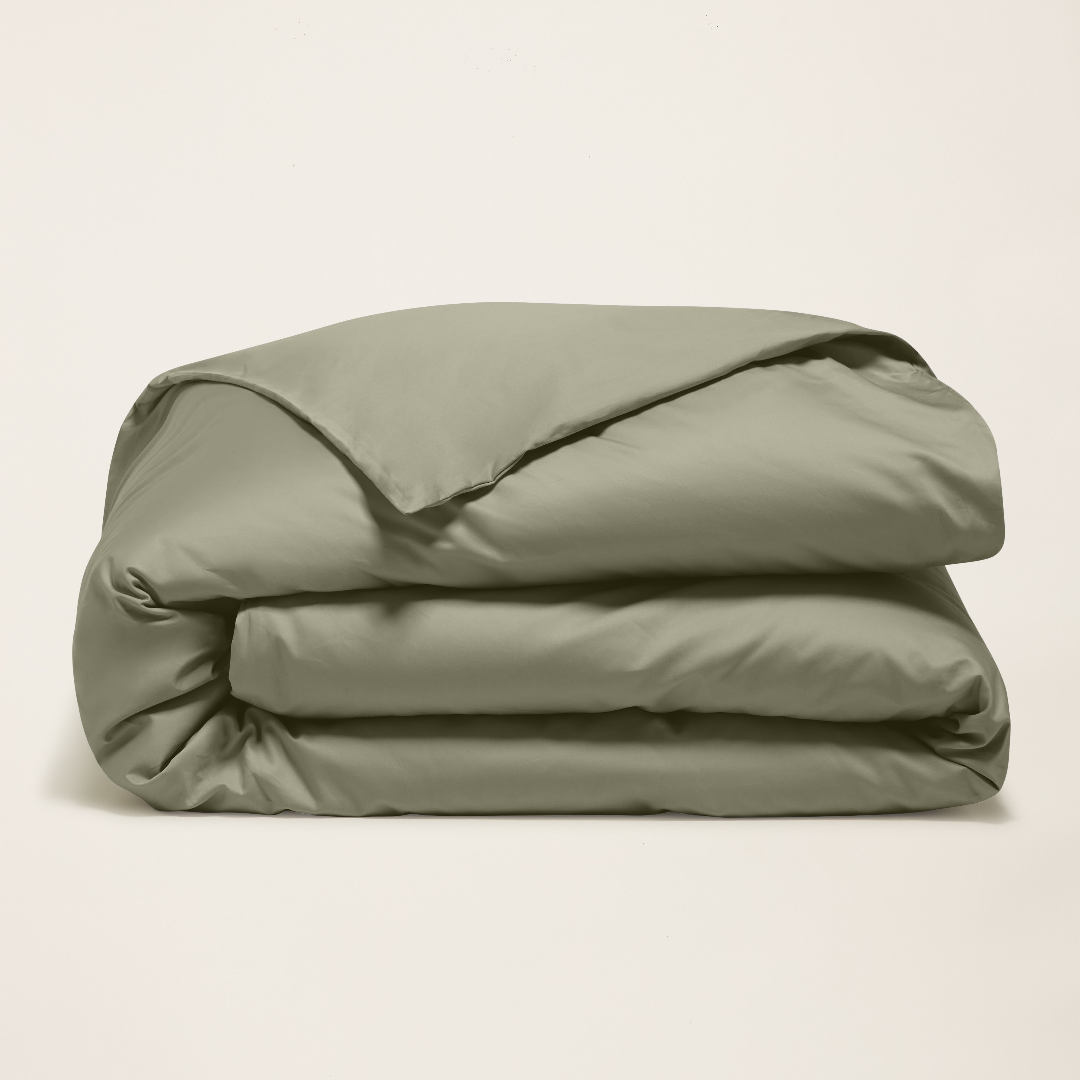 Soft beige Luxe Australian Sateen duvet cover from Italic, smooth fabric with a subtle sheen for a luxurious bed setting.
