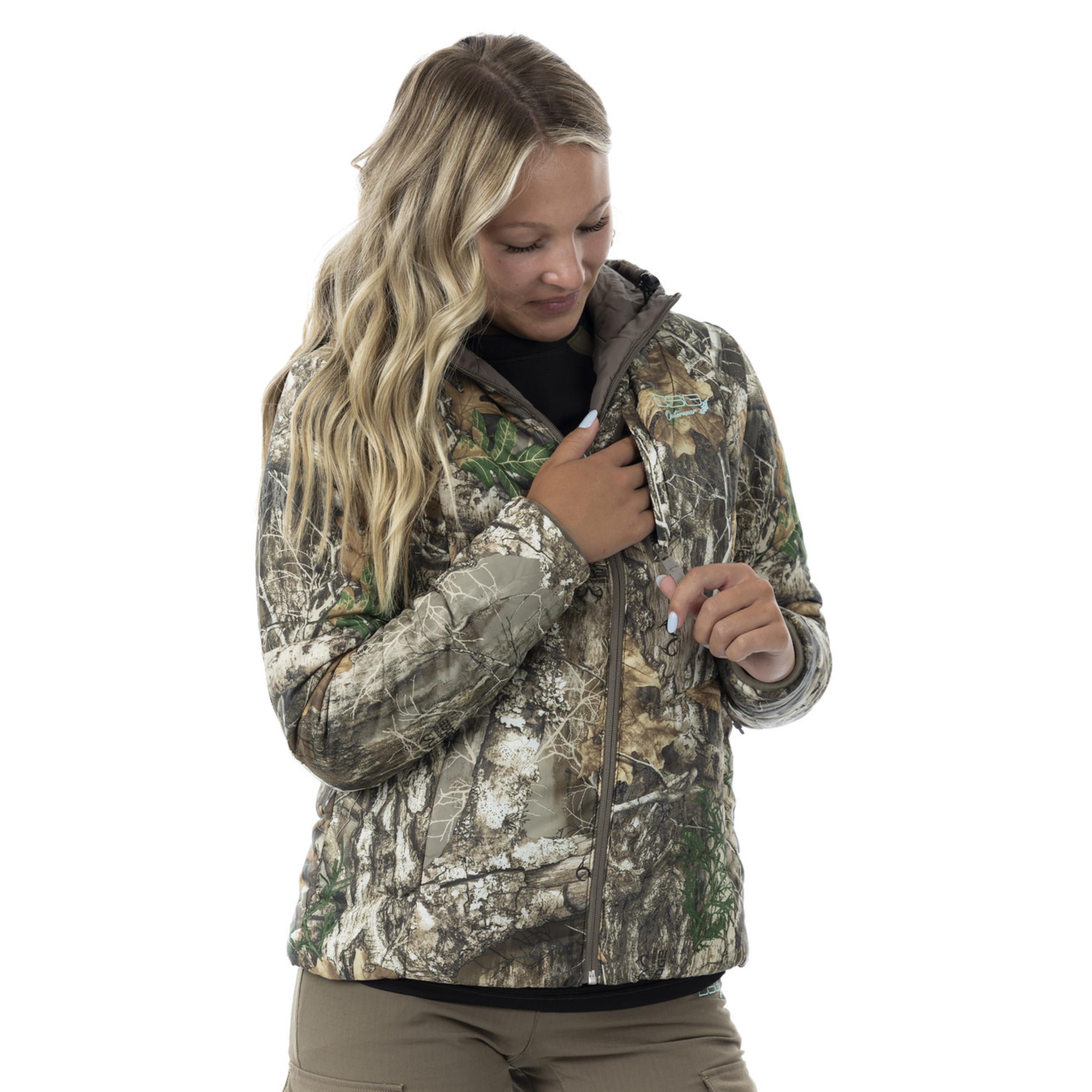 Reversible puffer jacket by DSG Outerwear, showing both quilted black and shiny silver sides, lightweight and insulated.
