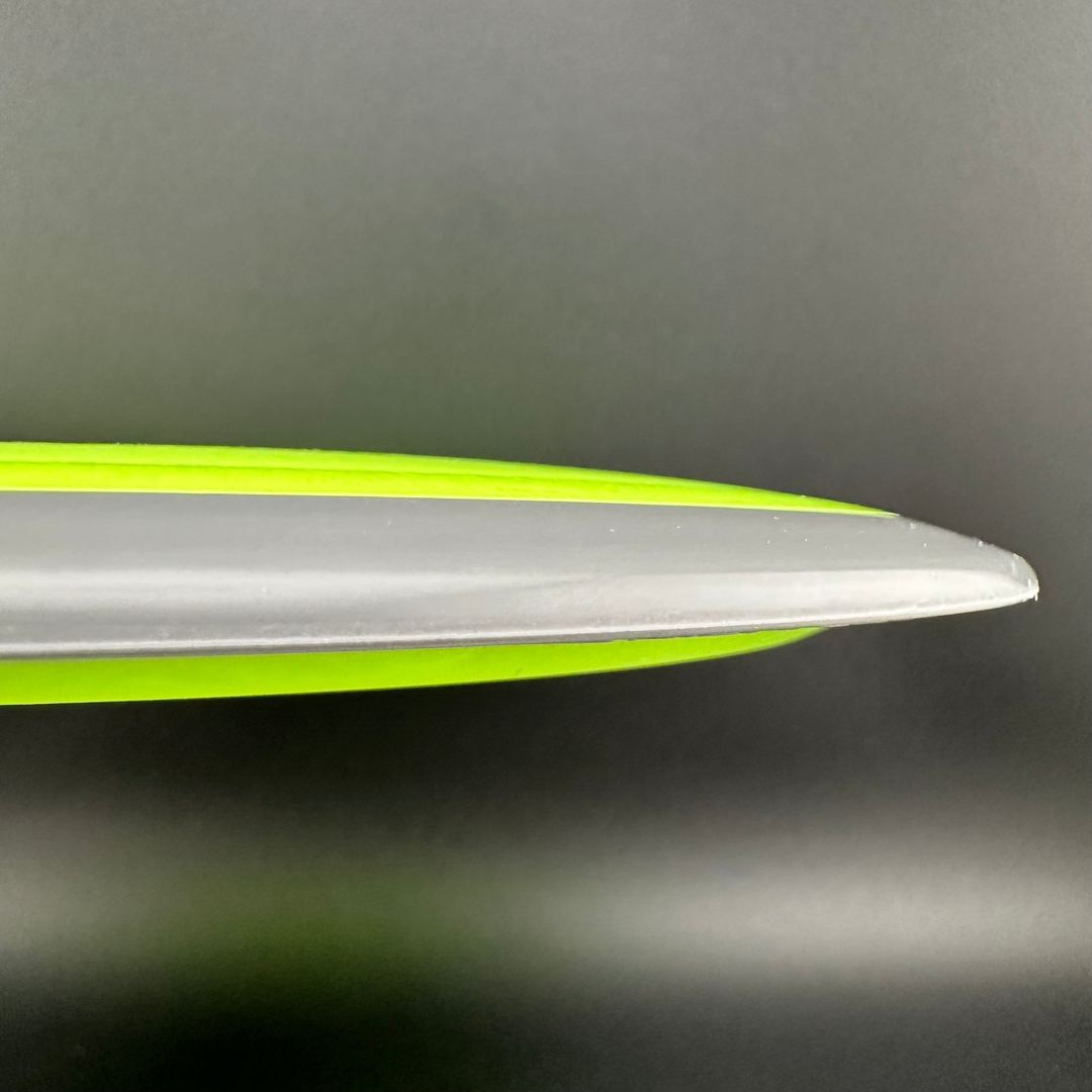 Disc golf disc Fission Defy Crushin' Amanitas VIP 2.0 by Manny Trujillo, branded Rare Air Discs, with vibrant design and flight features.