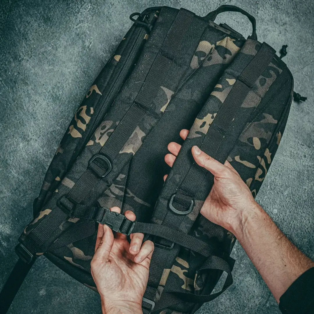 Recycled Firefighter 24 Hour Backpack in black with durable 500D material and multiple compartments for outdoor or daily use.