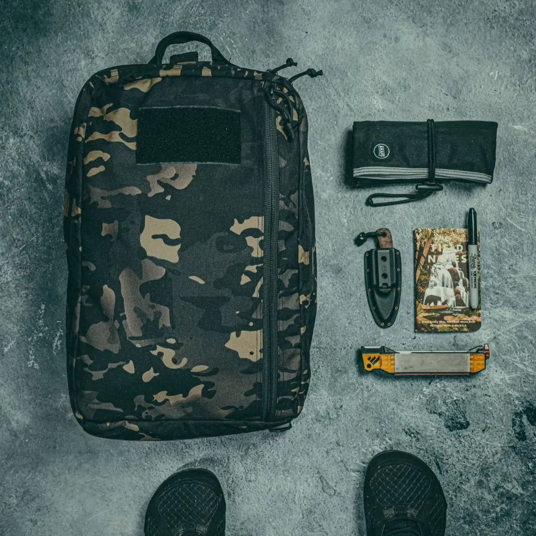 Recycled Firefighter 24 Hour Backpack in black with durable 500D fabric, featuring multiple compartments and sturdy straps.