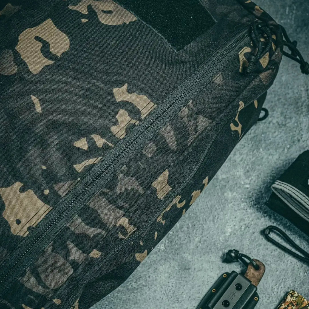 Recycled Firefighter 24 Hour Backpack made of durable 500D material, featuring multiple compartments and adjustable straps in black.