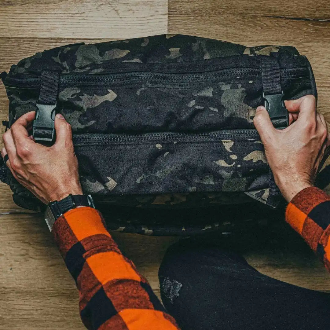 Recycled Firefighter 24 Hour PLUS Backpack in durable 500D fabric showing multiple compartments and sturdy straps.