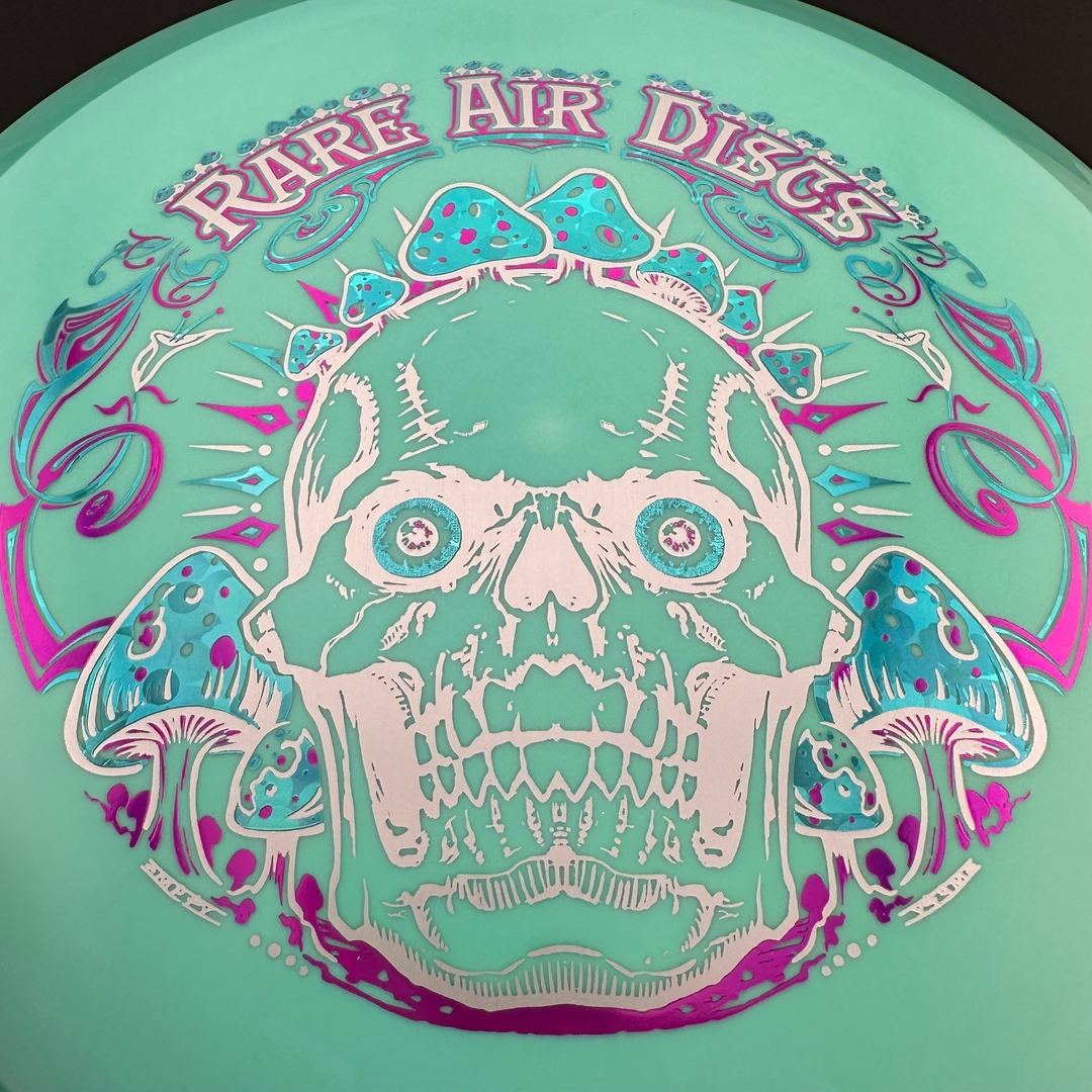 Fission Defy Crushin' Amanitas VIP 2.0 disc golf disc by Rare Air Discs, featuring vibrant colors and intricate design.