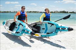 Backcountry Sportsman EZLite10™ Inflatable Kayak with Pro Carbon Package, showing the sleek, lightweight kayak design on water.