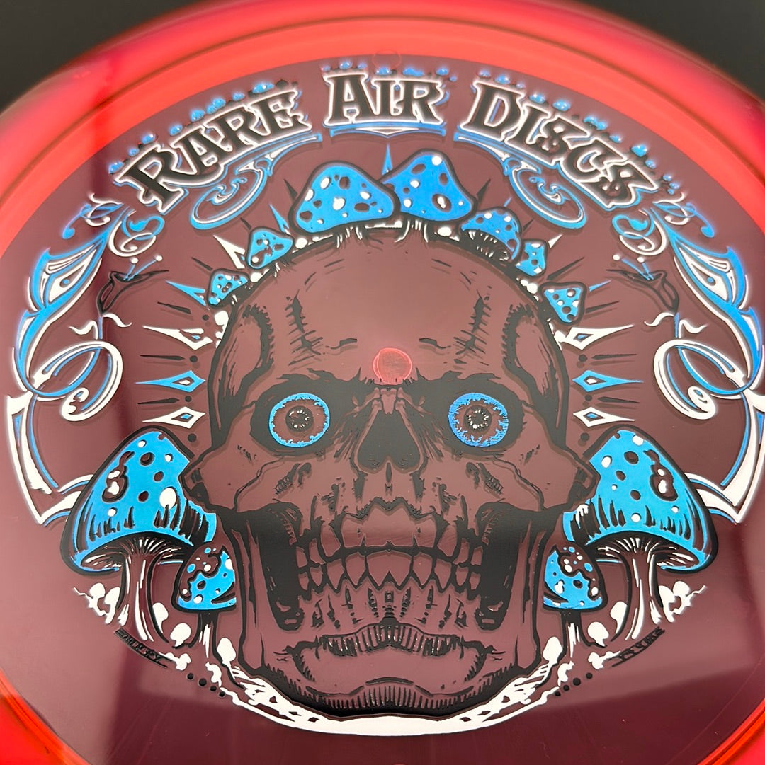 Disc golf stamp featuring Crushin' Amanitas by Manny Trujillo on a Rare Air Discs Ethos Construct disc.
