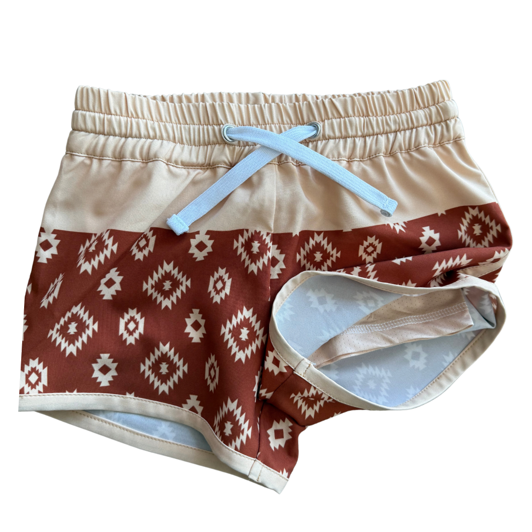 Color block hybrid shorts by Keep the Littles Wild featuring vibrant color panels and a casual fit for active wear.