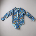 Colorful flowers swimsuit by Keep the Littles Wild featuring vibrant floral pattern and adjustable straps for kids.