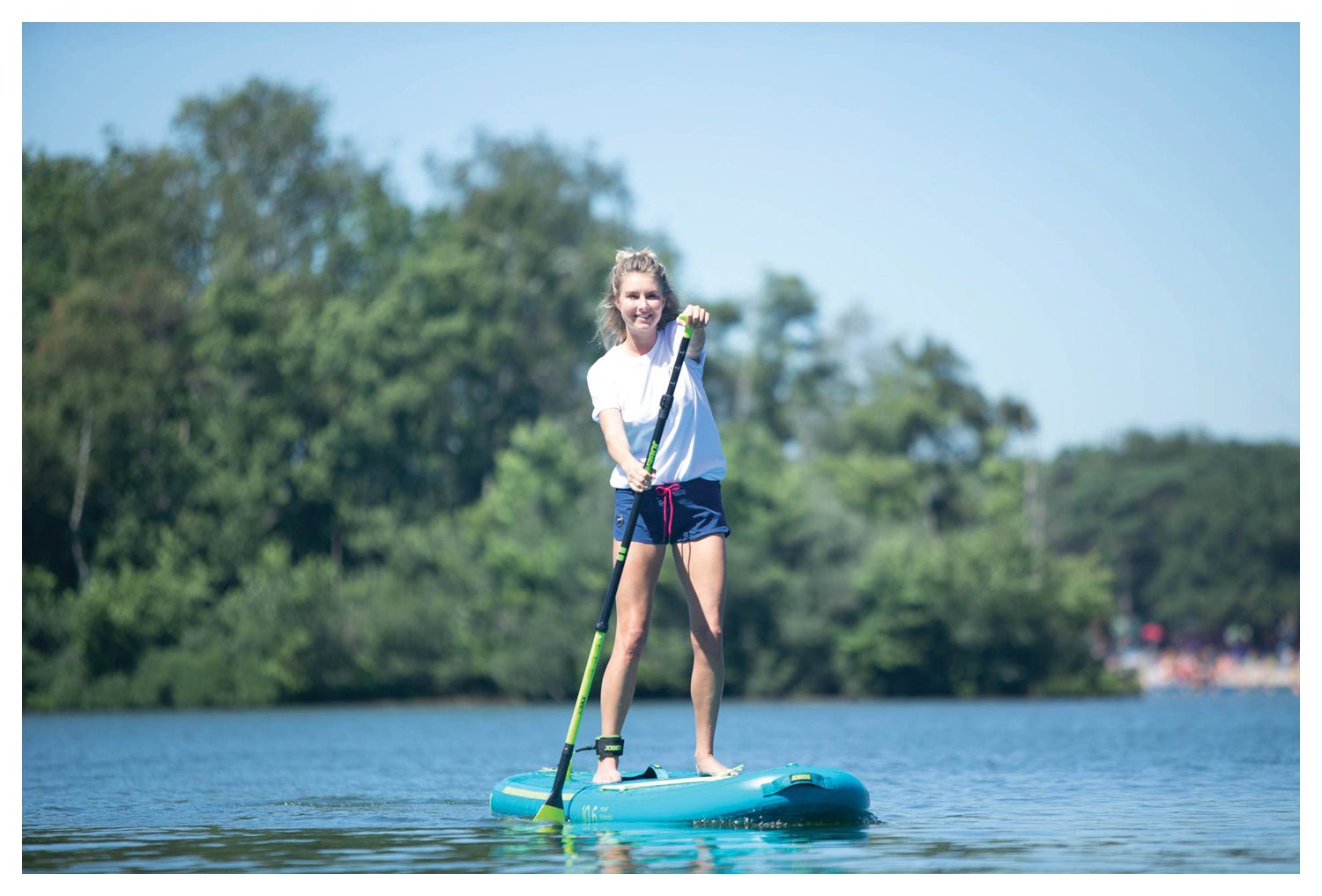 Inflatable Yarra 10.6 paddle board in teal from Backcountry Sportsman, shown fully inflated with a textured deck for stability.