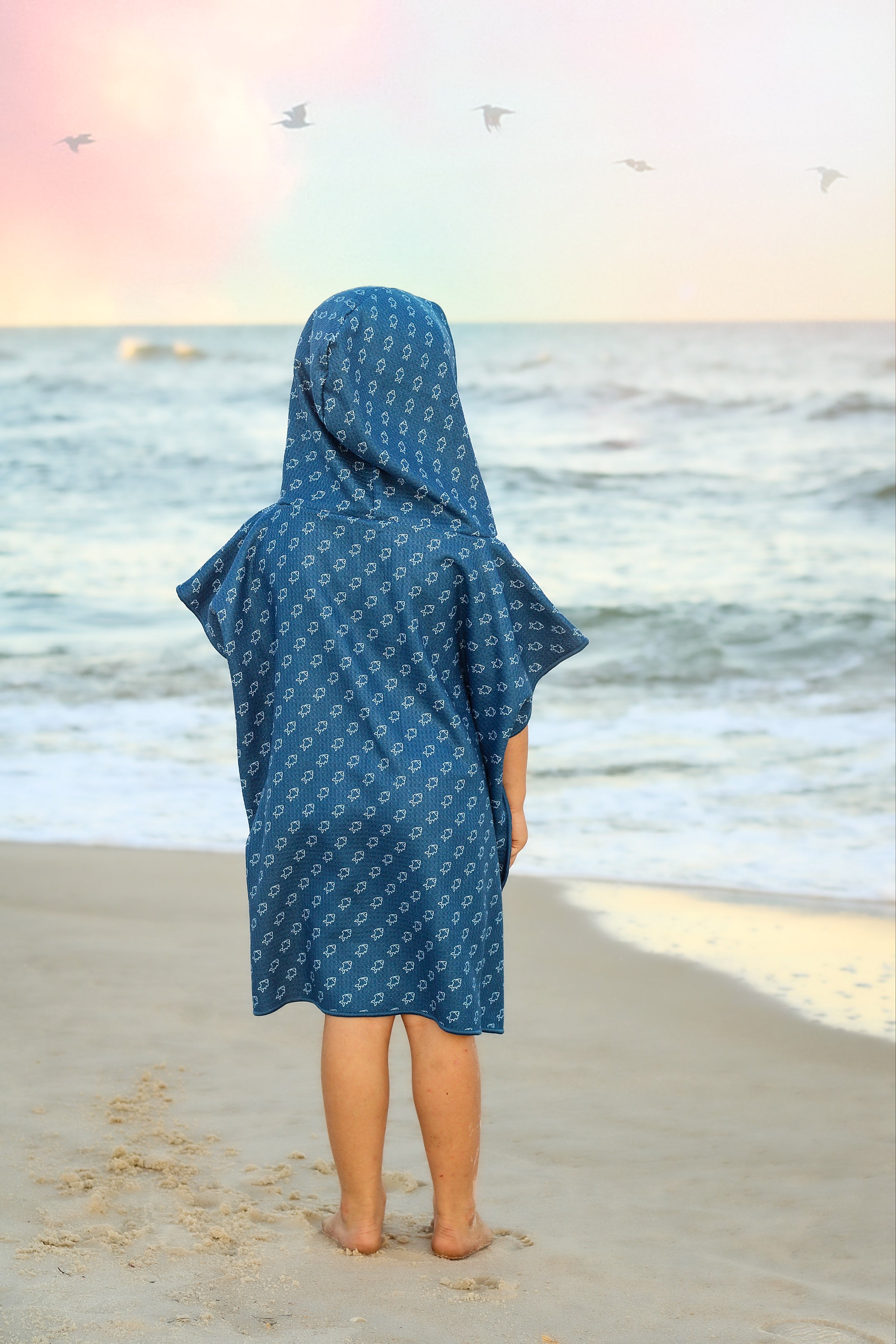 Blue microfiber fish waffle wearable towel by Keep the Littles Wild, featuring a fun fish design perfect for kids.
