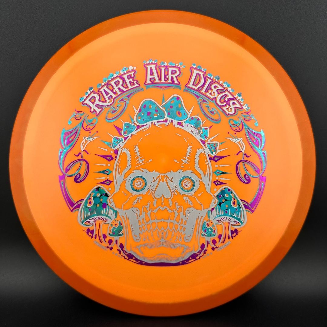 Fission Defy Crushin' Amanitas VIP 2.0 disc golf disc by Rare Air Discs displayed on a plain background.