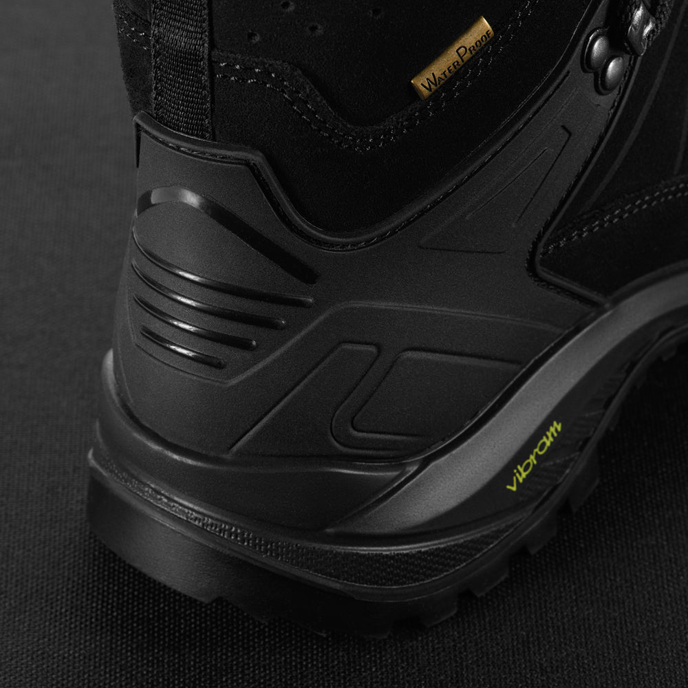 M-Tac tactical winter boots in black with rugged sole and reinforced toe, designed for durability and cold-weather use.