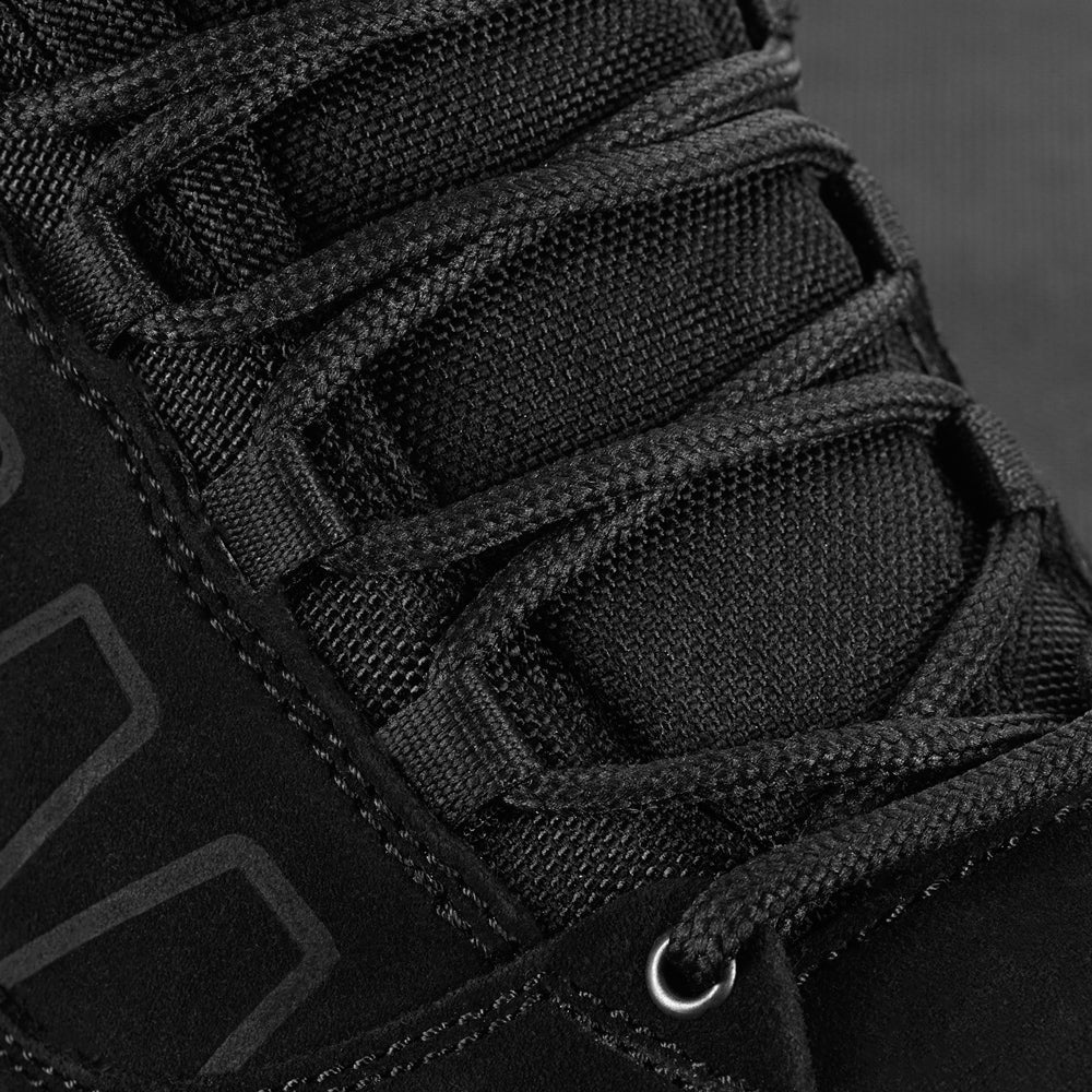 M-Tac tactical winter boots with rugged leather and waterproof sole, designed for cold weather and outdoor tactical use.