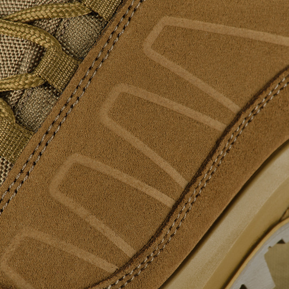 M-Tac tactical winter boots with rugged design, waterproof material, and sturdy soles for outdoor and tactical use.