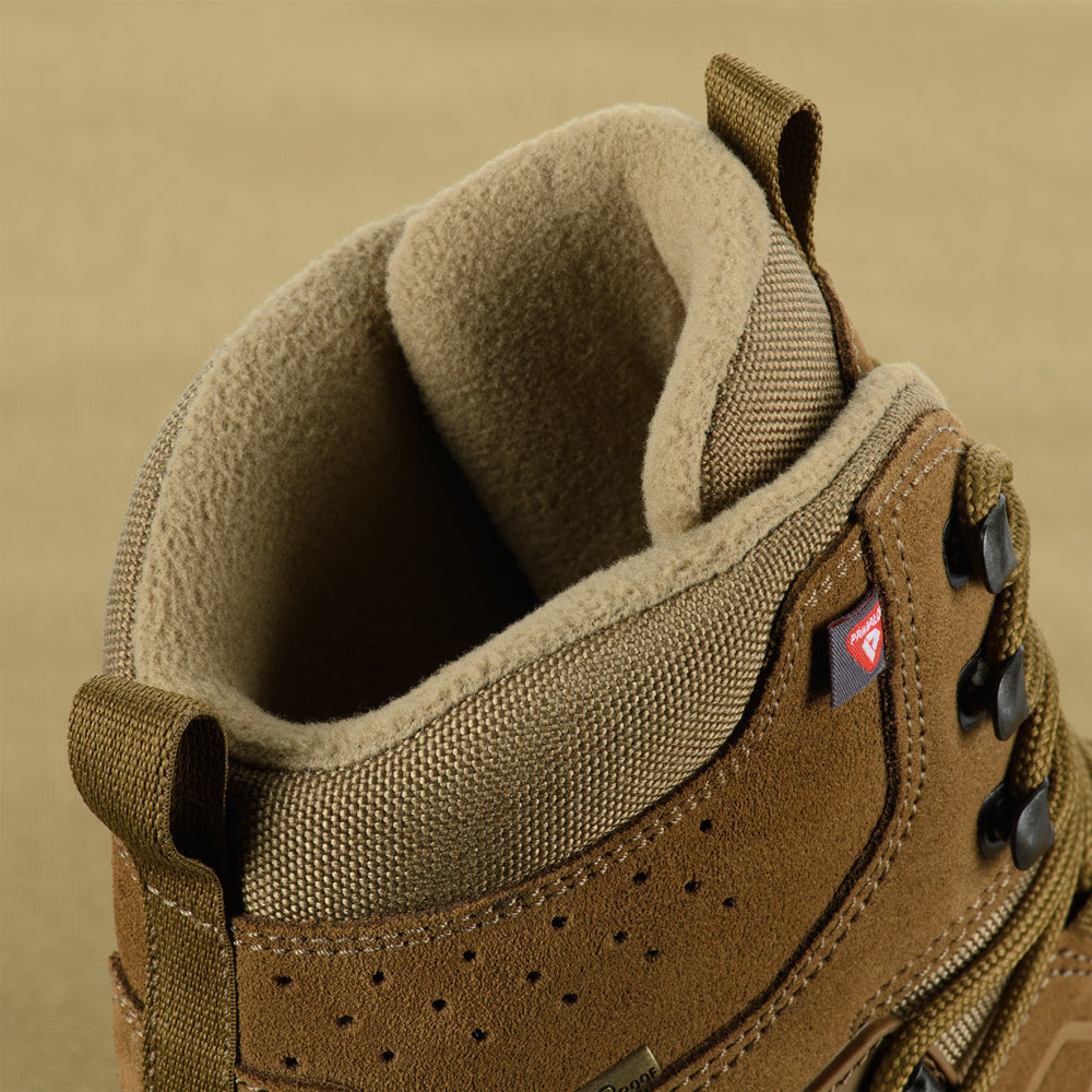 M-Tac tactical winter boots in black with rugged soles, designed for cold weather and outdoor tactical use.