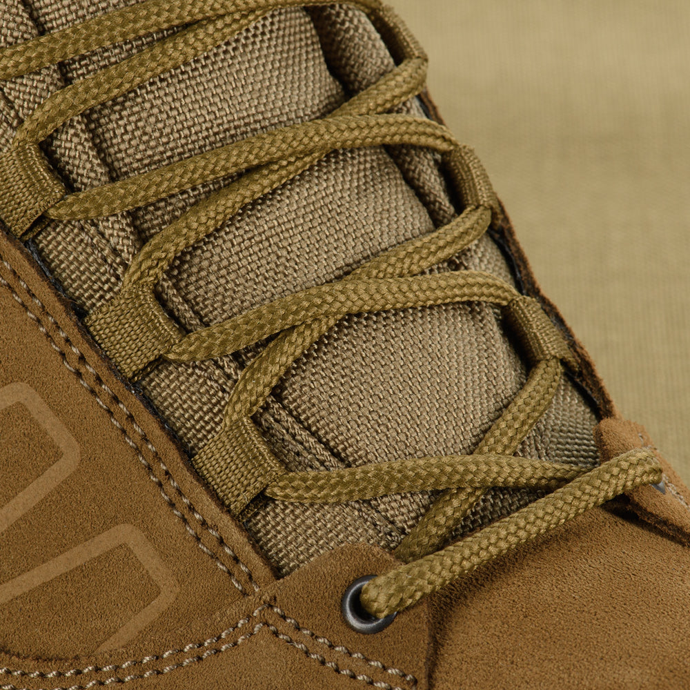 M-Tac tactical winter boots with rugged design, waterproof material, and reinforced soles for outdoor and tactical use.