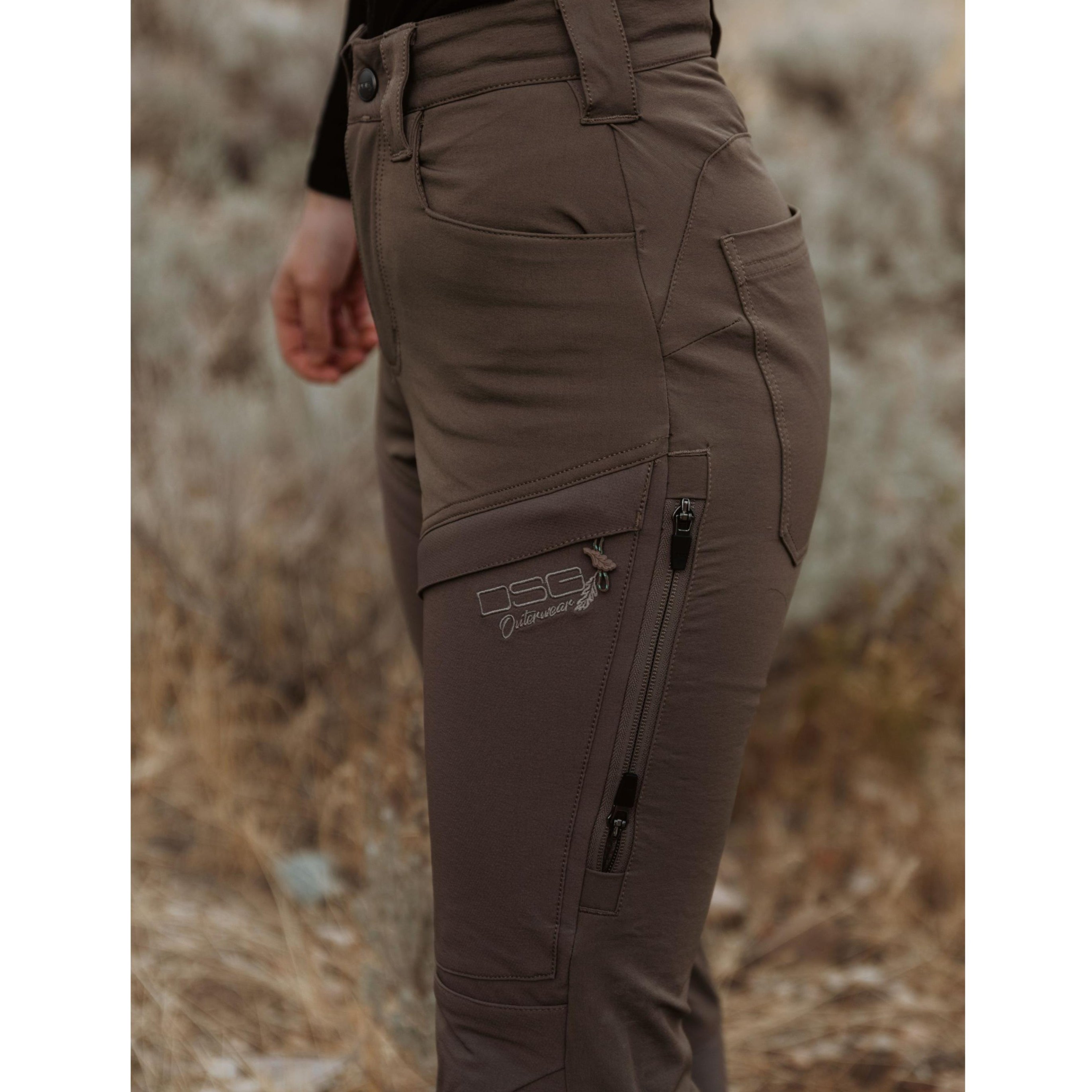 DSG Outerwear Kortni Upland Pant showing the beige outdoor pants with waistband and pockets on a model.