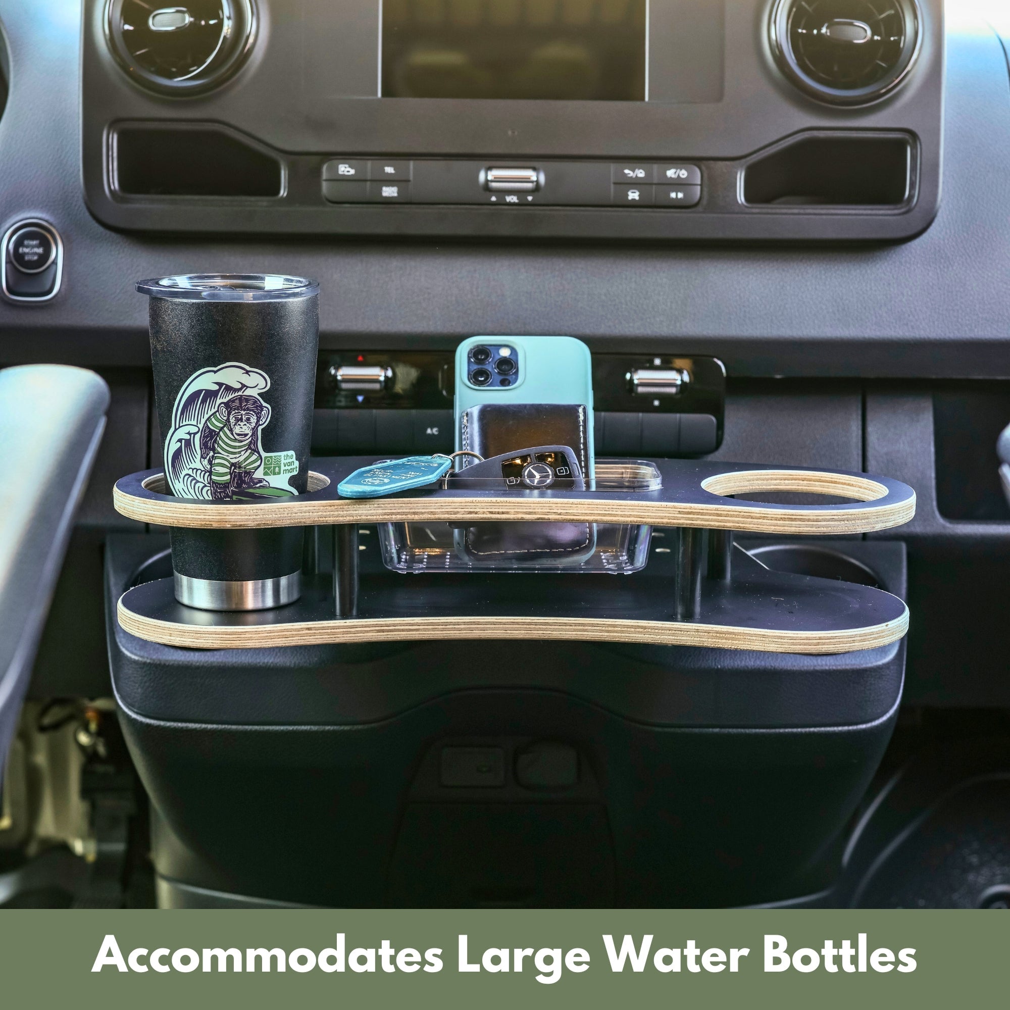 Sprinter Cupholder Tray by The Van Mart showing a black plastic tray with cup slots and storage compartments for 2019+ Sprinter vans
