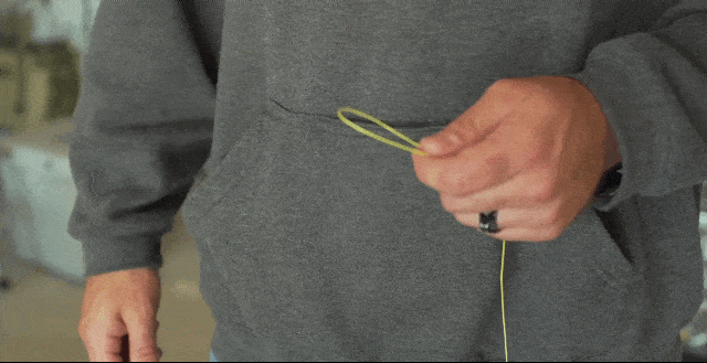 Line Cutterz blaze orange zipper pull featuring a ceramic blade for easy cutting and convenient attachment.