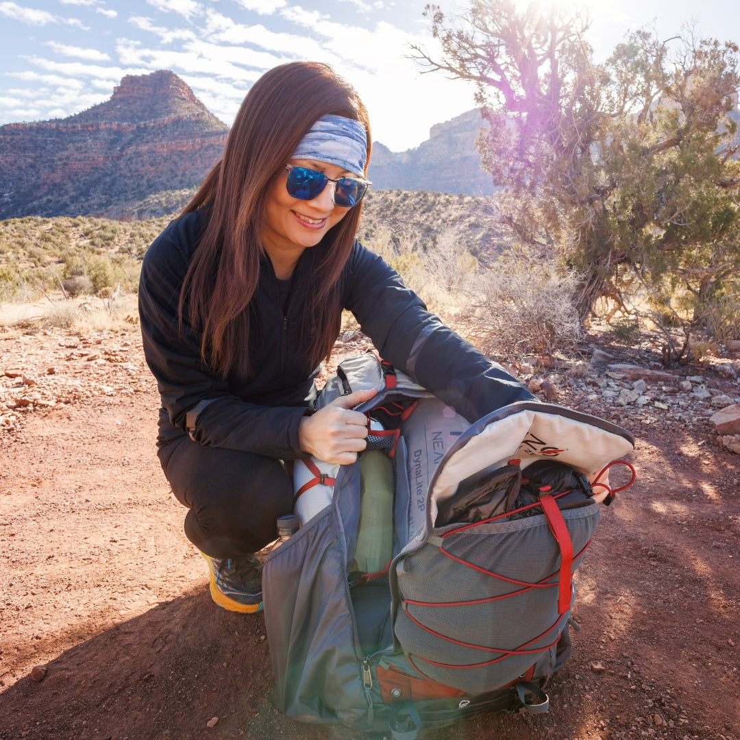 Near Zero Outdoor Gear Dean™ TR 50 overnight hiking backpack shown with adjustable straps and multiple compartments.