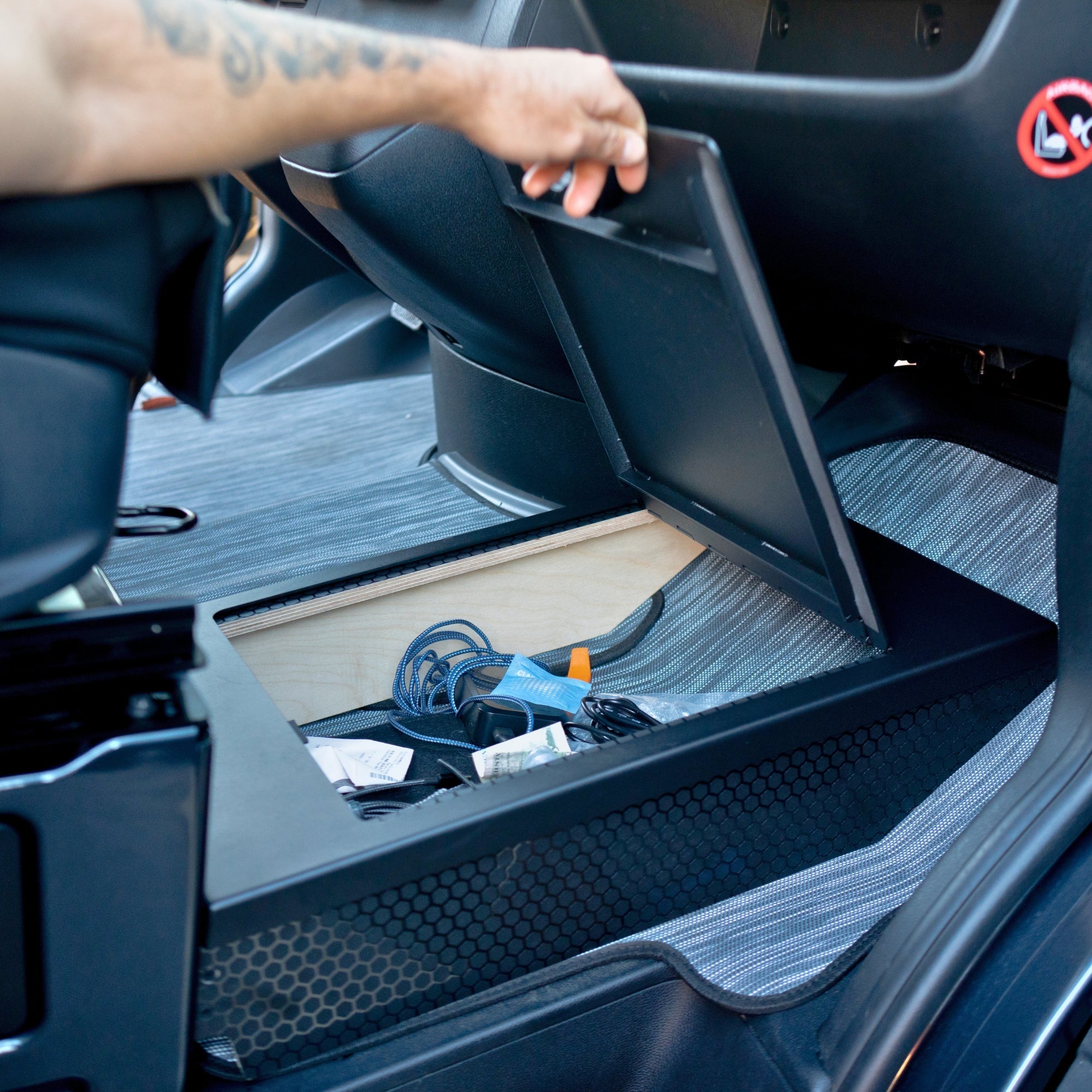 The Van Mart Sprinter footrest storage in a sleek design, showcasing ample storage space for vehicle interiors.
