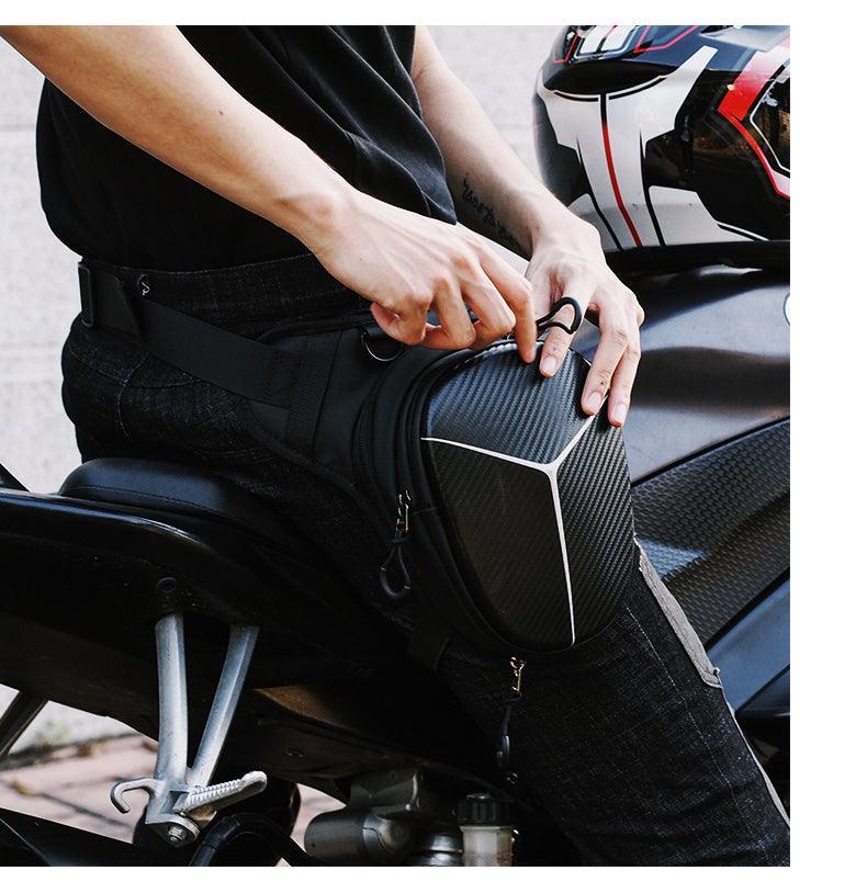 Albers ShadowStrike motorcycle leg bag by Bean's Moto Booth, black leather with adjustable straps and multiple compartments for gear.