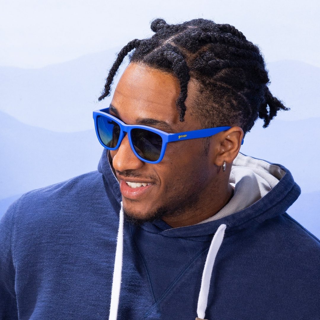Blue Lobster's SCUBA Revenge OG polarized sunglasses by Rare Air Discs, shown in a lifestyle setting with sleek blue frames.